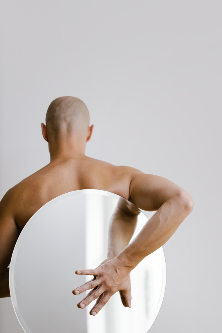 Topless Boy Holding White Round Plate